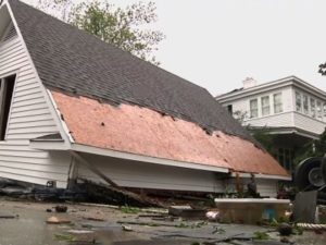 A damaged home with shingles missing from the roof in the aftermath of Hurricane Florence | New Bern, North Carolina